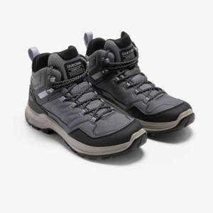 Quechua MH100 women’s grey hiking boots – pair Pair of grey Quechua MH100 women’s waterproof hiking boots, front view